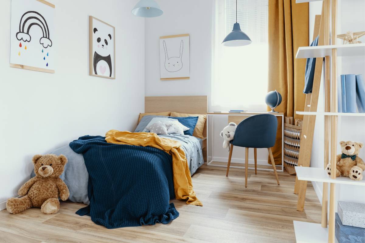 Kids bed in a child's bedroom with furniture and toys