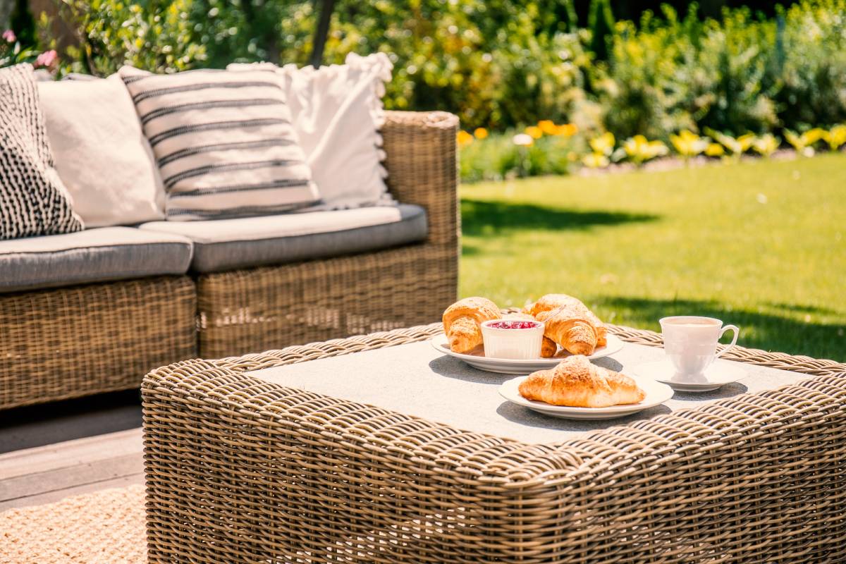 Outdoor wicker sofa and wicker coffee table.